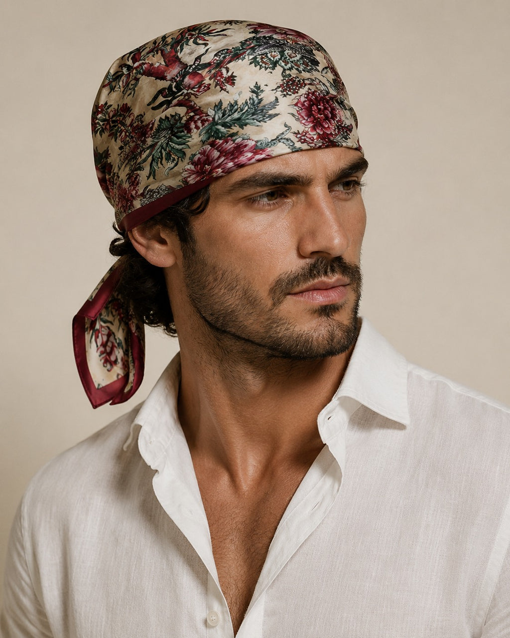 Male model wearing the Autumn Chintz silk bandana tied on the head