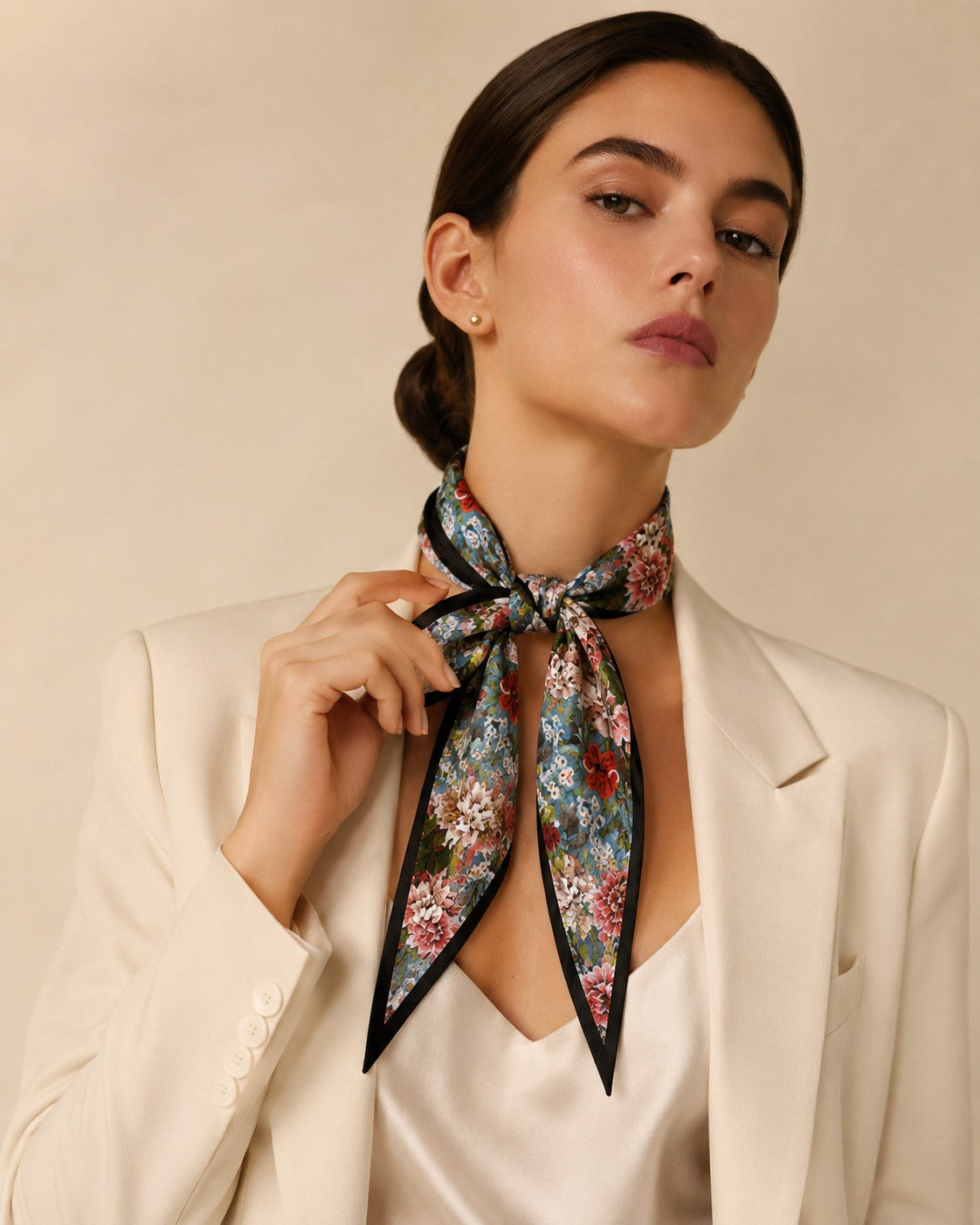 Model wearing the Midnight belting scarf tied at the neck