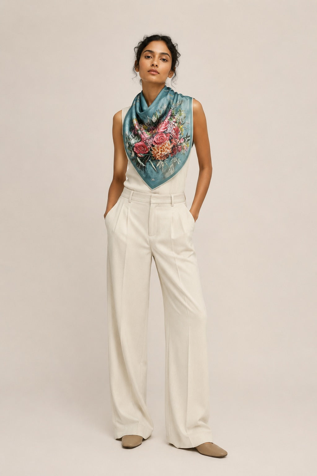 Model wearing the Cecil silk scarf draped at the neck with cream tailoring