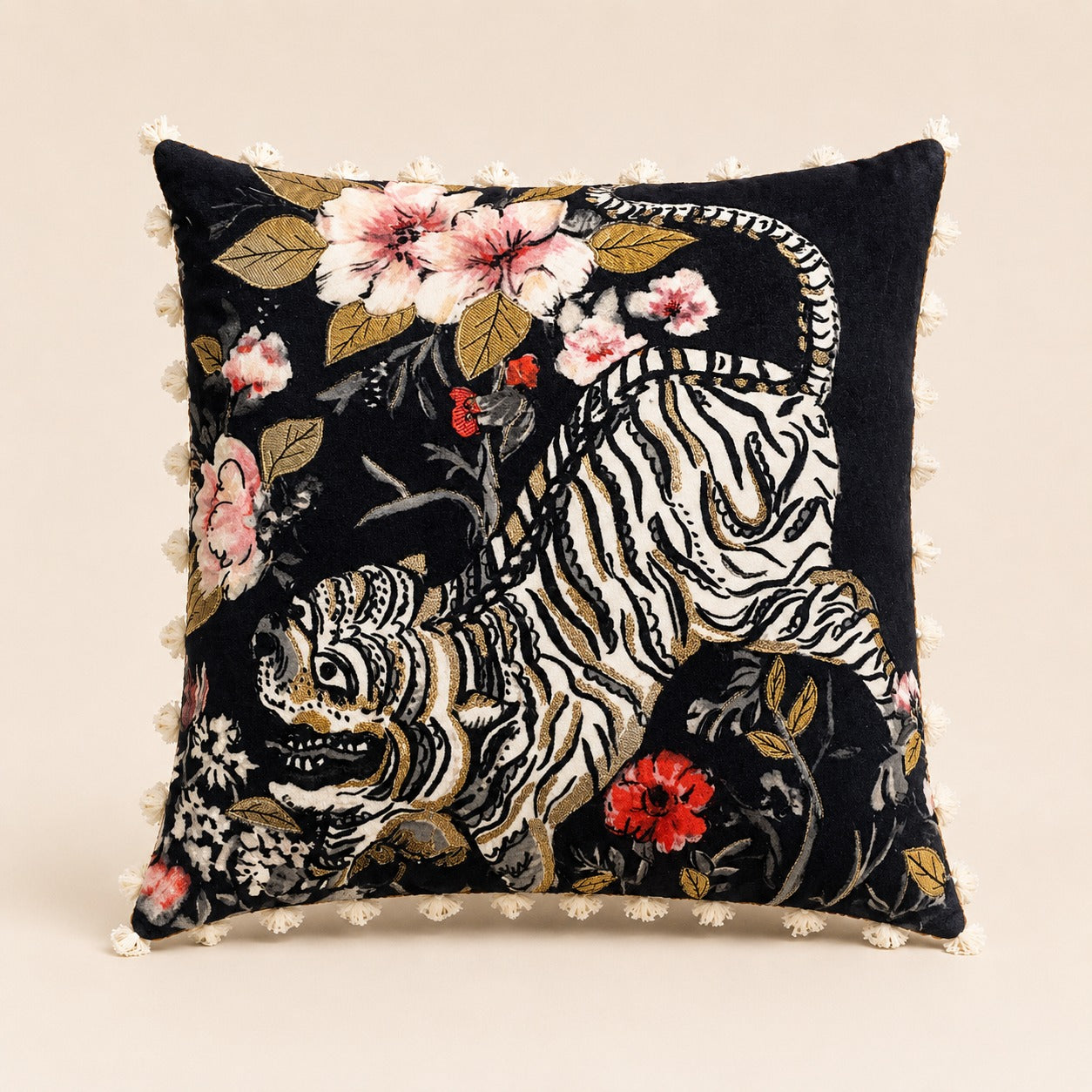 Golden Tiger Cushion — gold-embroidered tiger among blossoms on black velvet with tassel trim