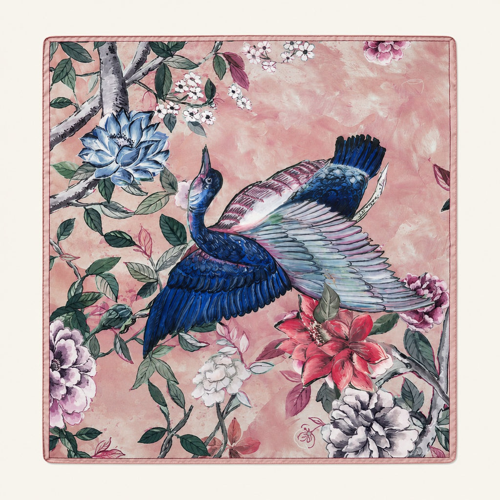 Heron Blossom silk scarf, 40x40 — hand-painted blue heron and blossoms on rose pink, satin flat lay