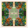 Jungle Caracal silk scarf, 40x40 — mirrored jungle cats and foliage with burnt-orange border, satin flat lay