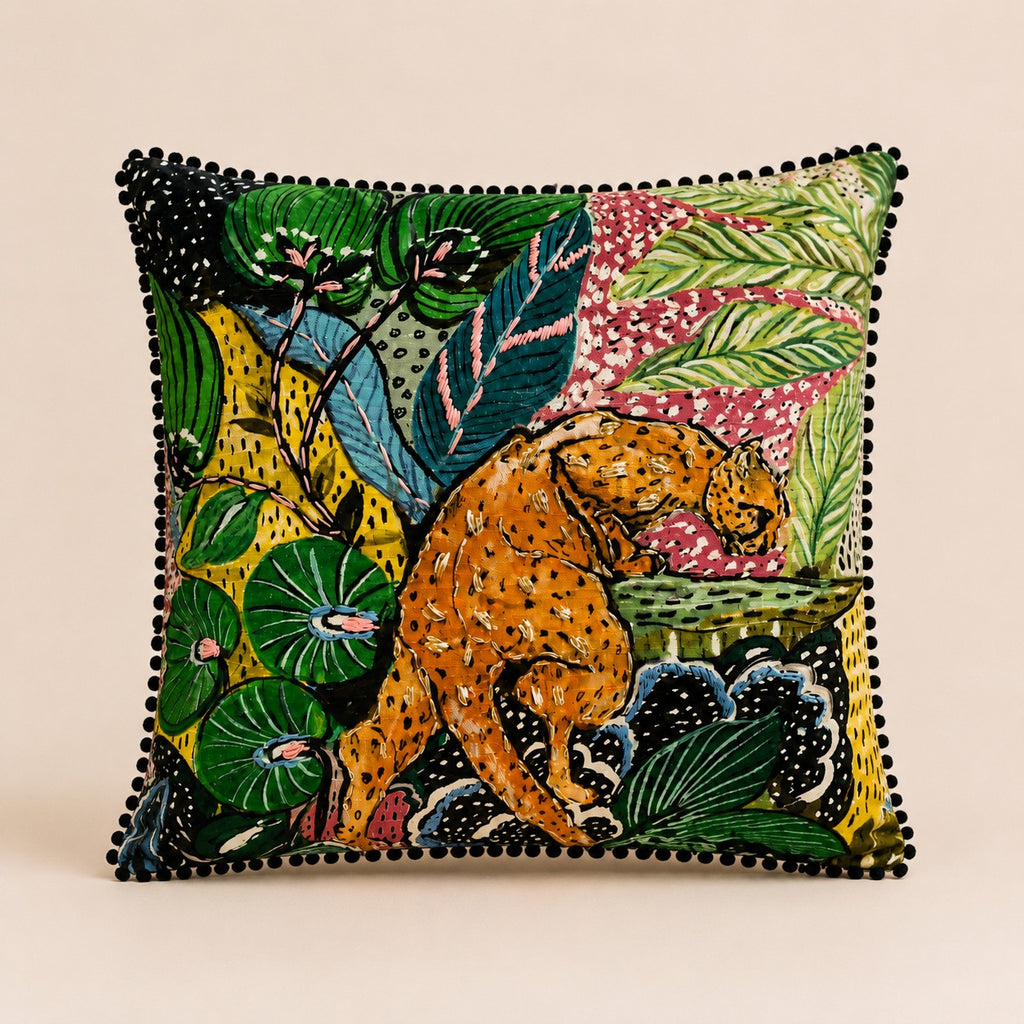 Jungle Leopard Cushion — leopard in a vivid rainforest print with black pom-pom trim