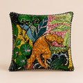 Jungle Leopard Cushion — leopard in a vivid rainforest print with black pom-pom trim