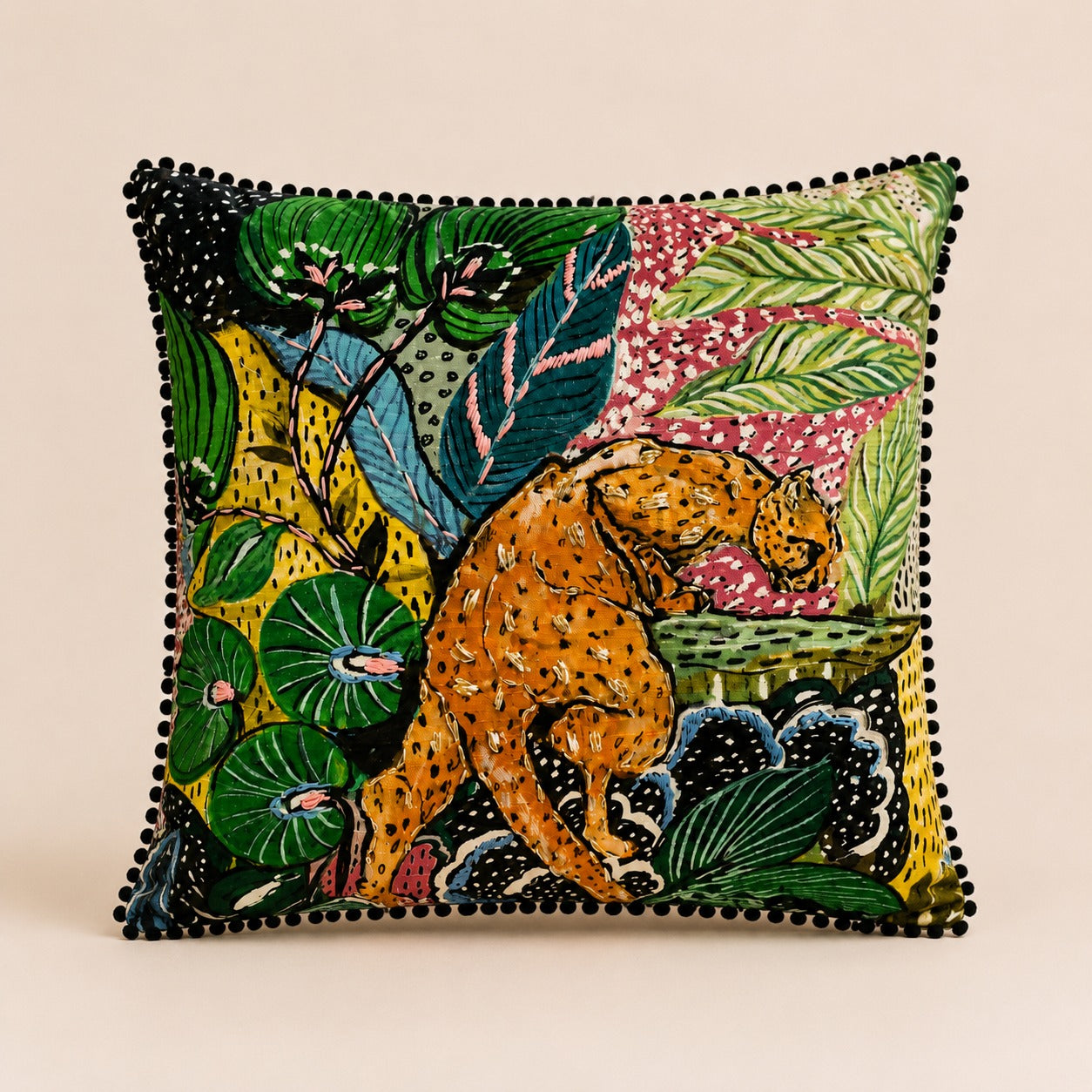 Jungle Leopard Cushion — leopard in a vivid rainforest print with black pom-pom trim