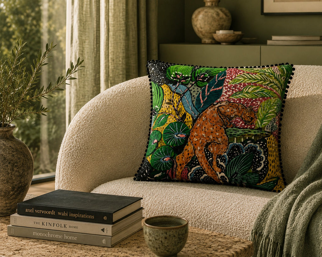 Jungle Leopard Cushion styled on a cream boucle chair in a sunlit room