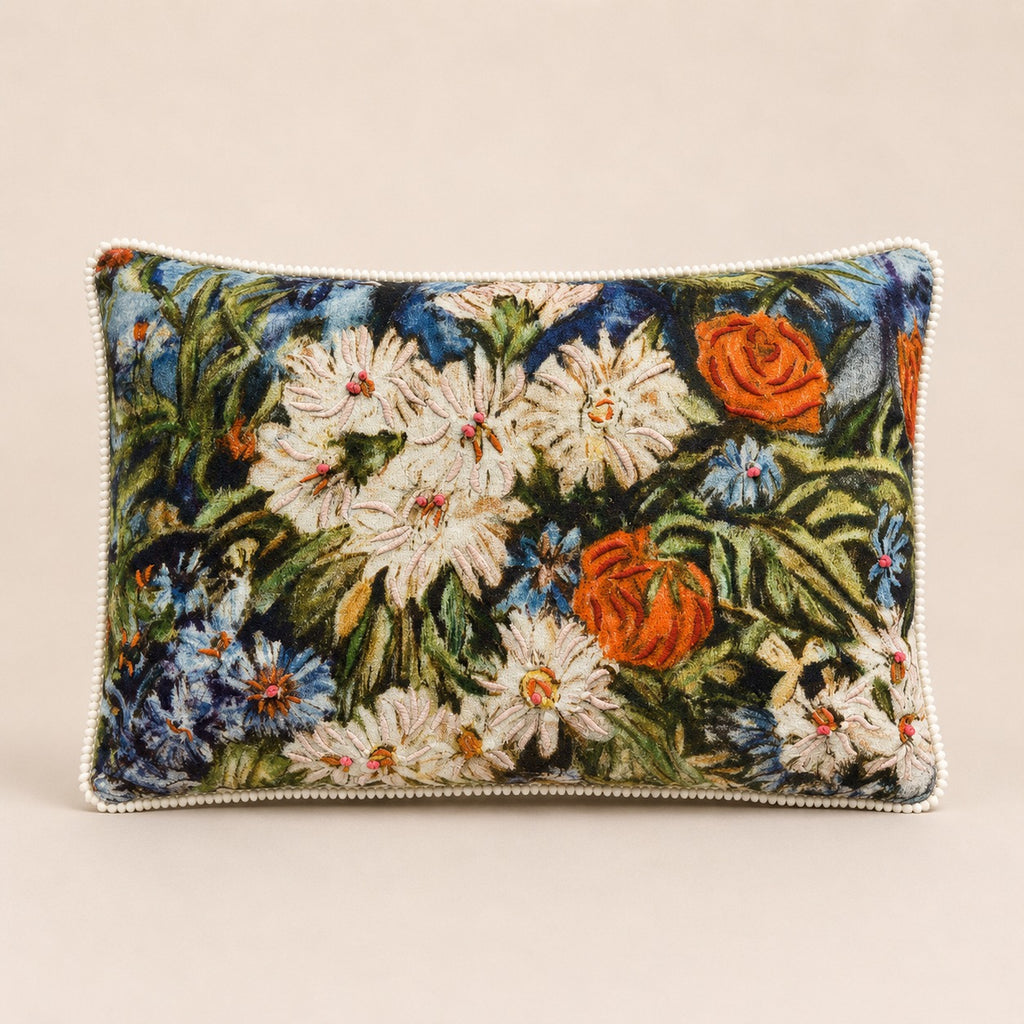 Meadow Daisy Cushion — impressionist daisies and poppies embroidered on velvet with cream pom-pom trim