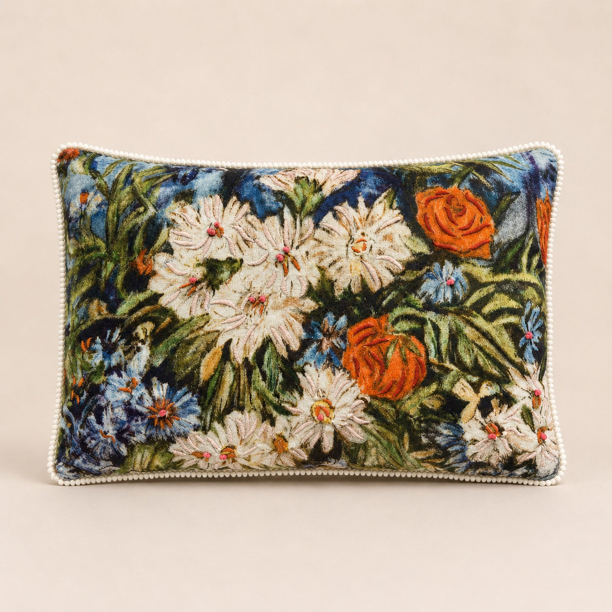 Meadow Daisy Cushion — impressionist daisies and poppies embroidered on velvet with cream pom-pom trim