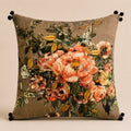 Tweed Rose cushion — peach and coral roses on a bronze tweed ground with black pom-poms, flat catalogue