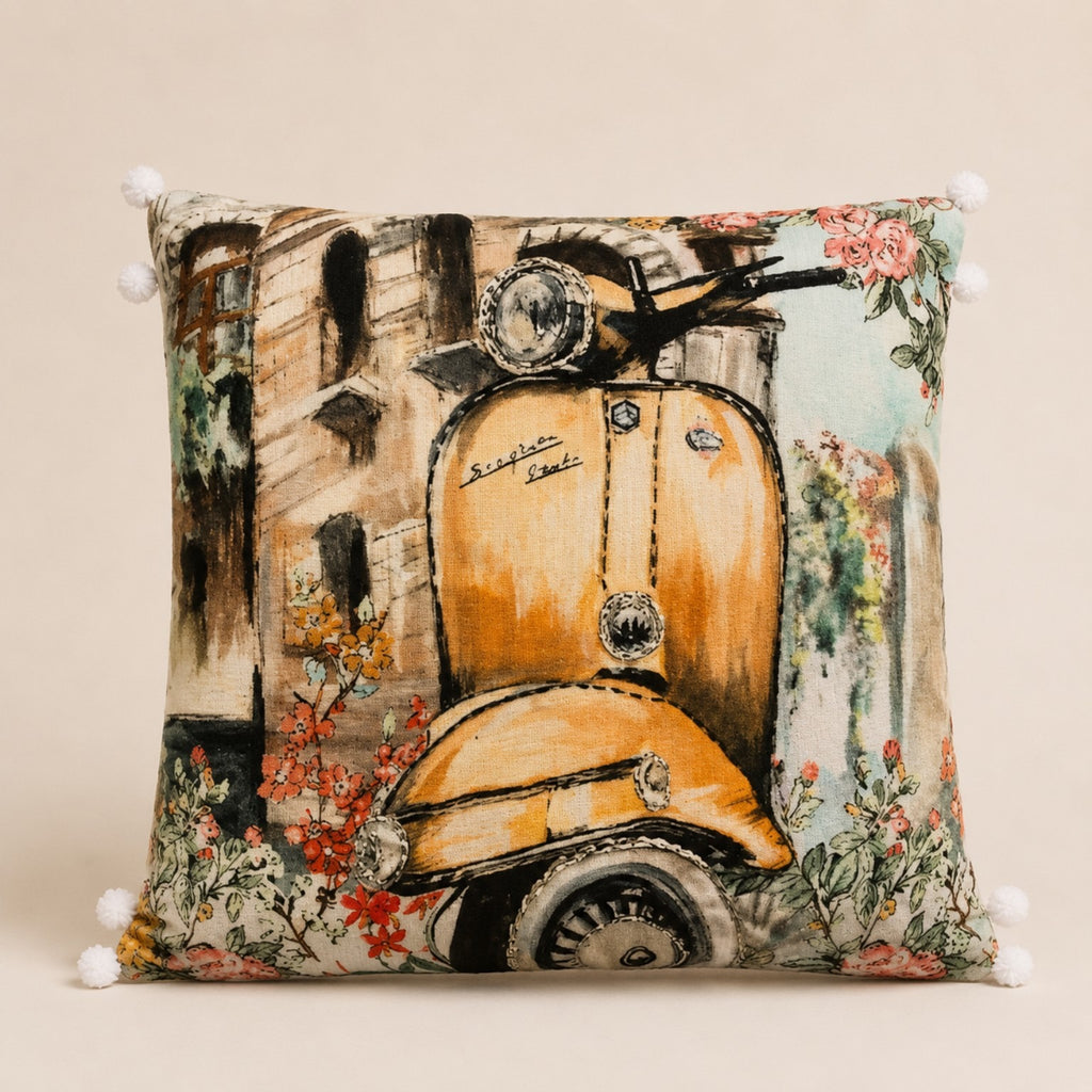 Vintage Scooter Cushion — amber scooter on a flower-framed street, watercolour on velvet with pom-pom trim