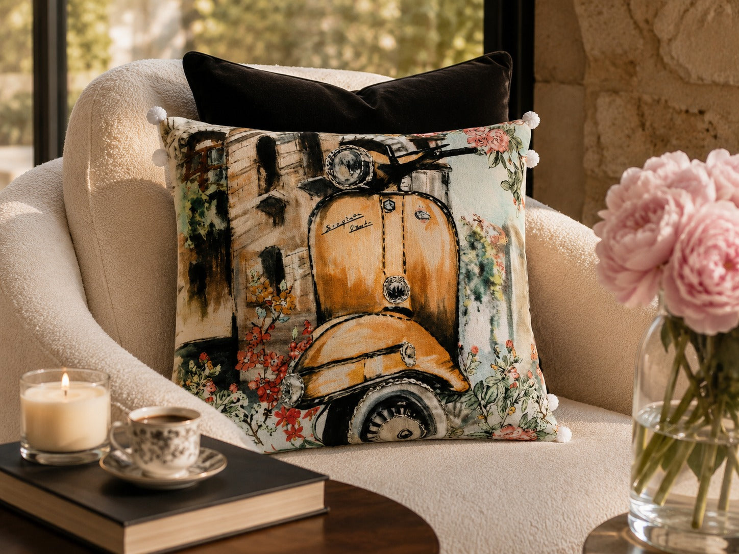 Vintage Scooter Cushion styled on a cream armchair beside pink peonies