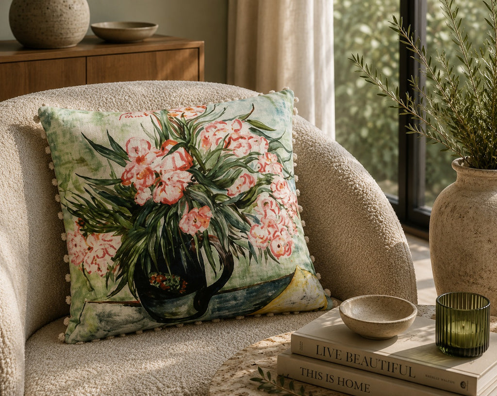 Willow cushion styled on a cream bouclé armchair beside a window